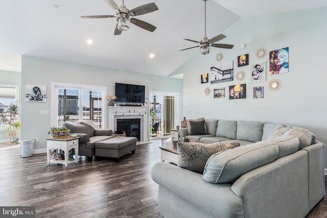 living room featuring ceiling fan, vaulted ceiling, and dark hardwood / wood-style flooring