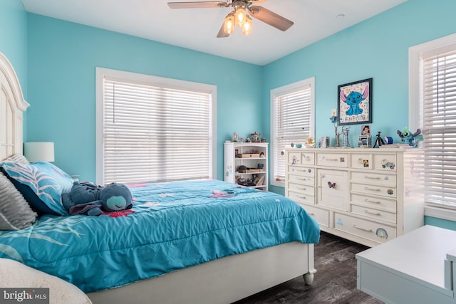 bedroom featuring ceiling fan and dark hardwood / wood-style flooring