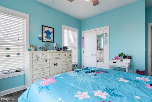 bedroom with ceiling fan and a closet