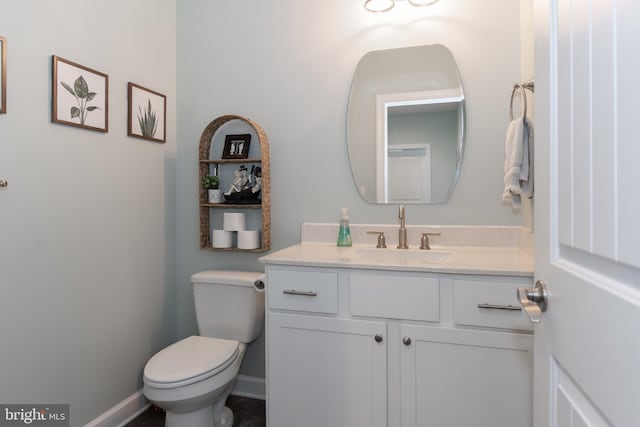 bathroom with toilet and vanity