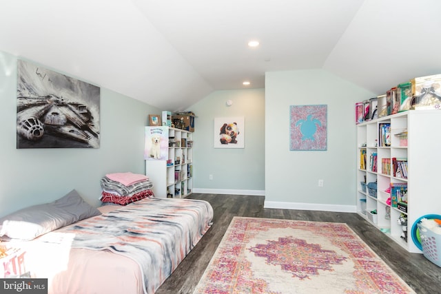 bedroom with lofted ceiling and dark wood-type flooring