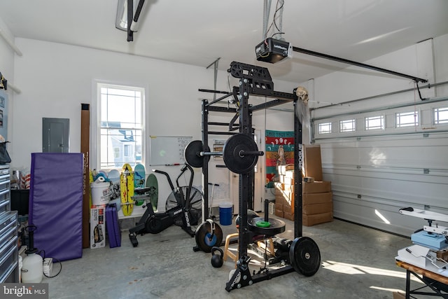 garage with electric panel and a garage door opener