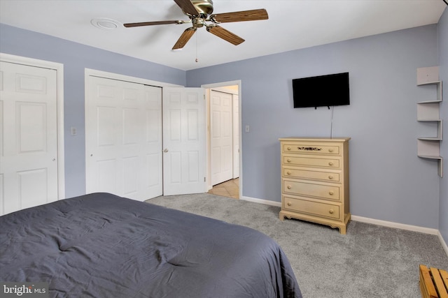 bedroom with light carpet and ceiling fan