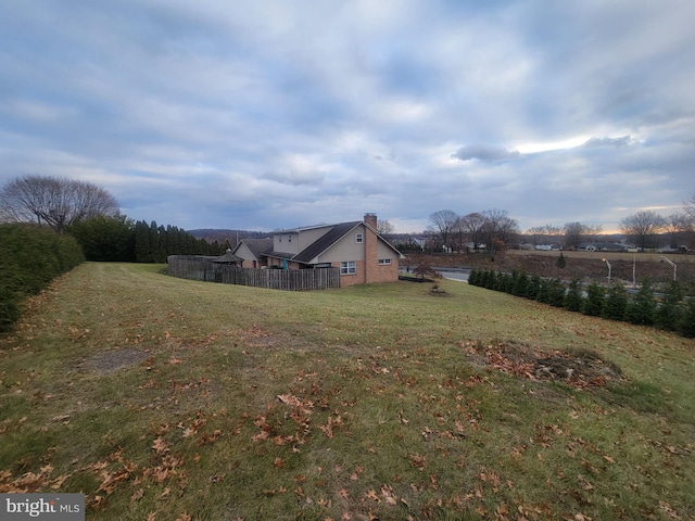 view of yard with a rural view