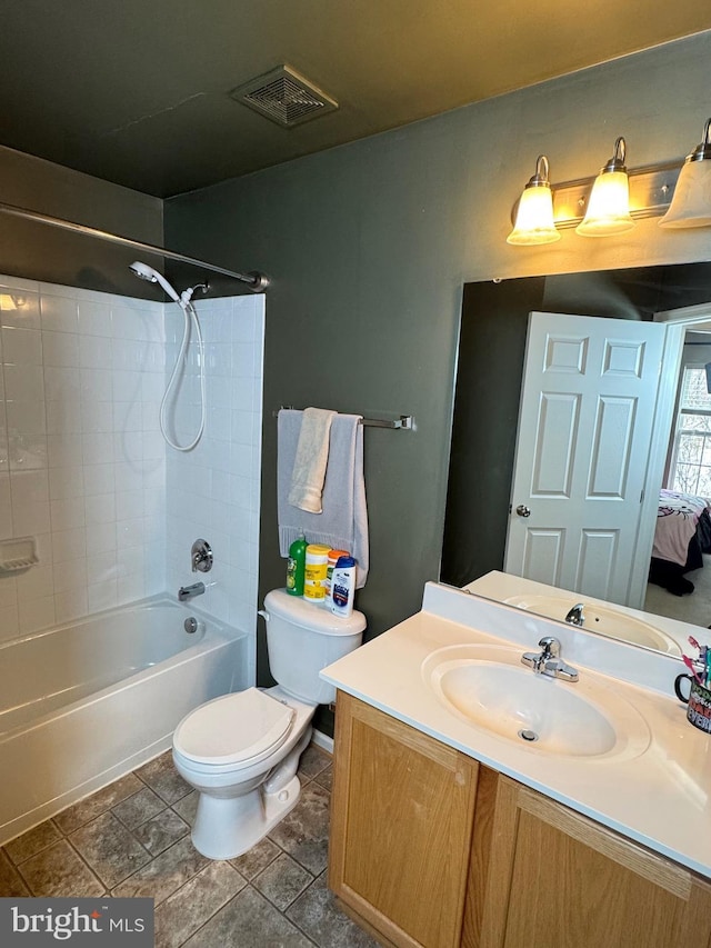 full bathroom with  shower combination, vanity, and toilet