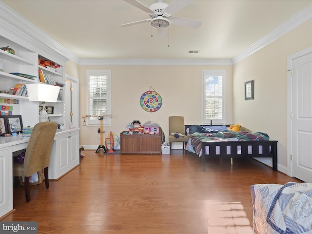 dining space featuring wood-type flooring, ornamental molding, plenty of natural light, and ceiling fan