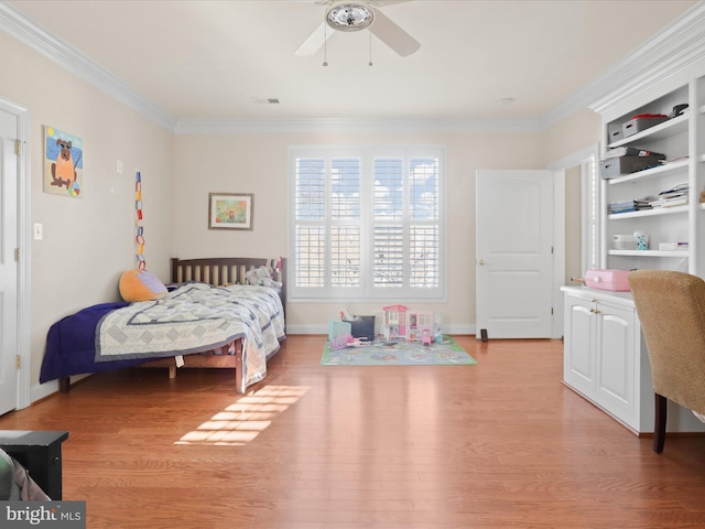 bedroom with ceiling fan, light wood-type flooring, and ornamental molding