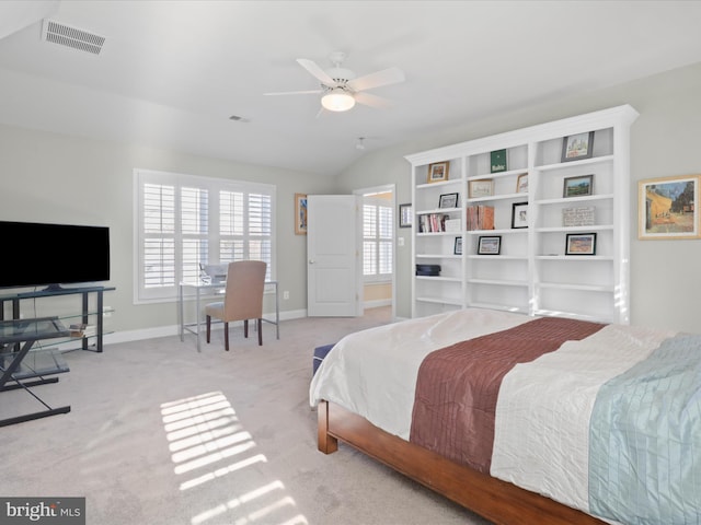 carpeted bedroom featuring ceiling fan and vaulted ceiling