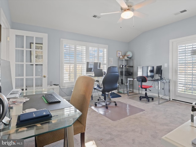 carpeted office with ceiling fan, vaulted ceiling, and plenty of natural light