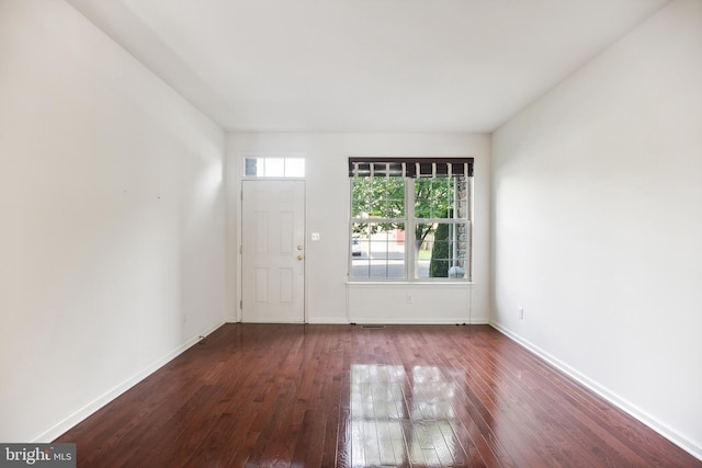 unfurnished room featuring hardwood / wood-style flooring