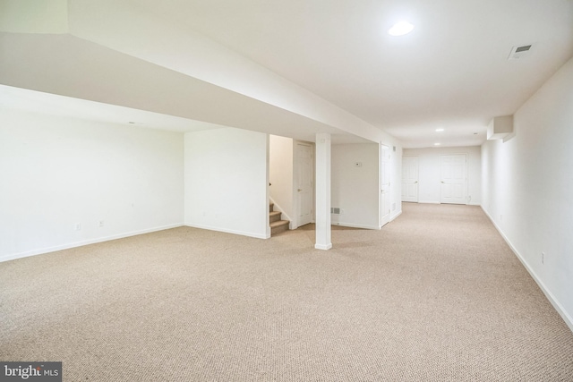 basement with light colored carpet