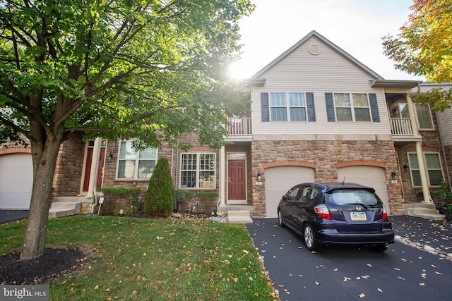 view of front of property featuring a garage and a front lawn