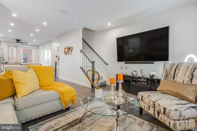 living room with recessed lighting, stairway, and baseboards