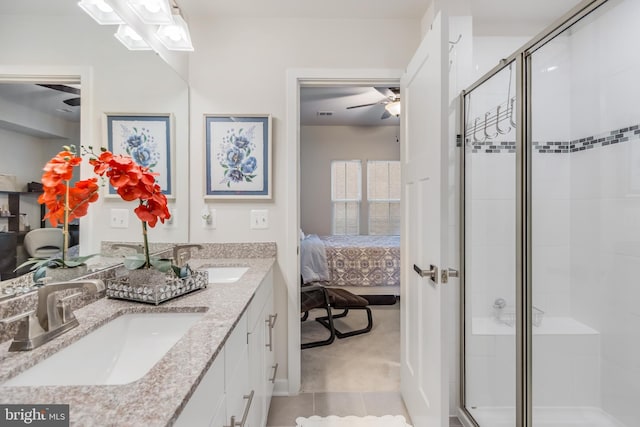 ensuite bathroom with a sink, double vanity, ensuite bath, and a shower stall