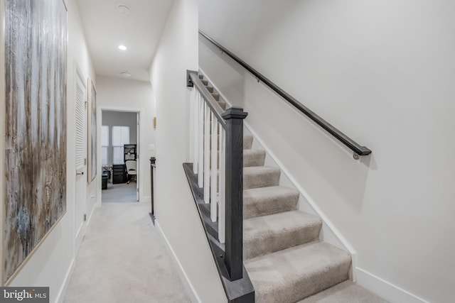 staircase with carpet flooring, recessed lighting, and baseboards