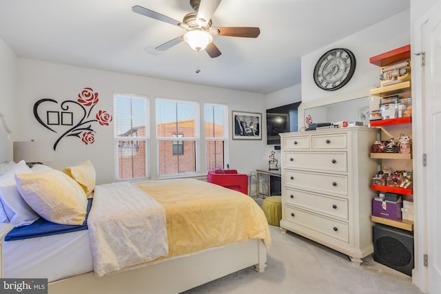 bedroom featuring a ceiling fan and light colored carpet