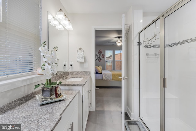 bathroom with vanity, a ceiling fan, ensuite bath, a shower stall, and tile patterned floors