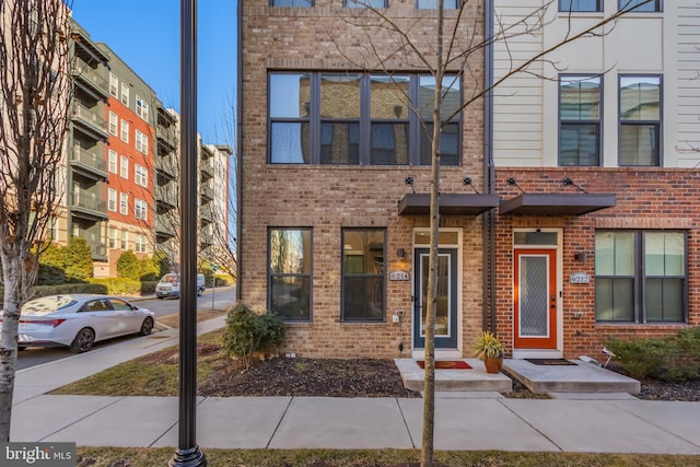 multi unit property featuring brick siding