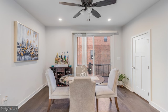 dining area featuring recessed lighting, wood finished floors, and baseboards