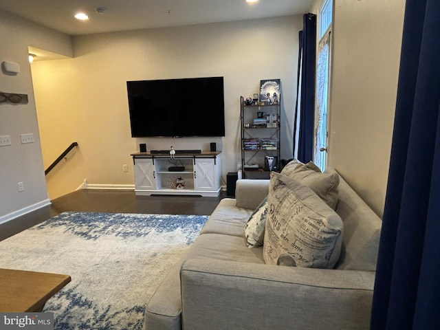 living room featuring dark wood-type flooring