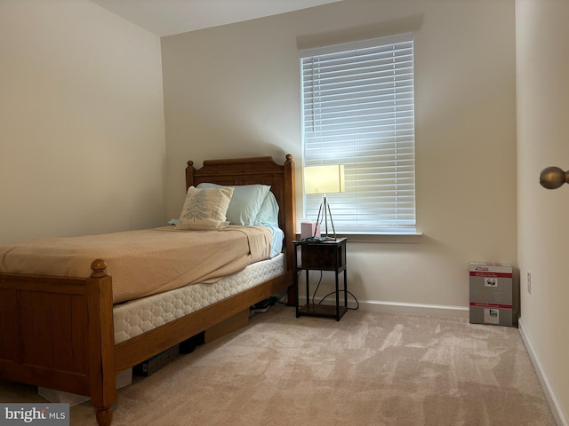 bedroom with light carpet