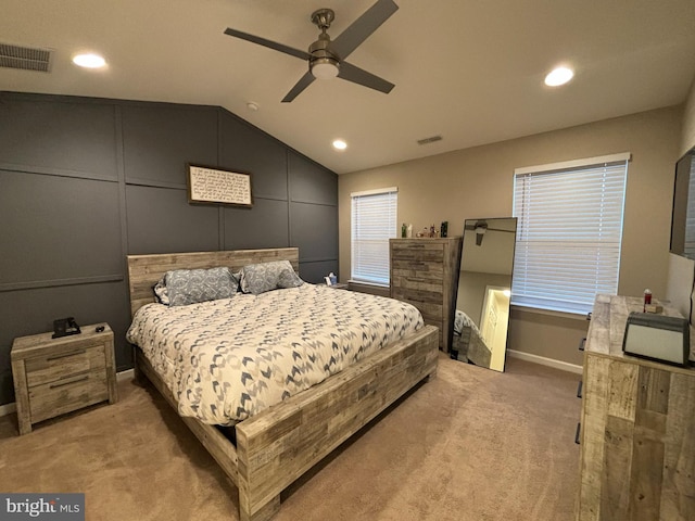 carpeted bedroom featuring vaulted ceiling and ceiling fan