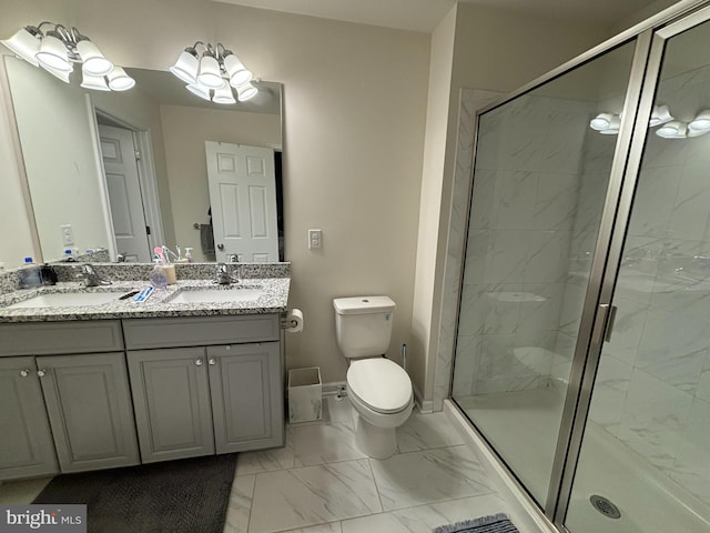 bathroom featuring vanity, walk in shower, and toilet