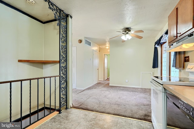 interior space featuring ceiling fan and a textured ceiling