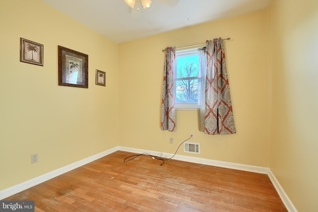 empty room featuring ceiling fan and light hardwood / wood-style floors