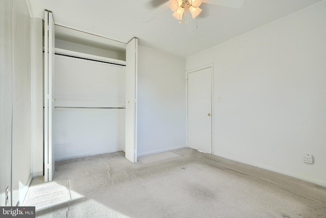 unfurnished bedroom featuring ceiling fan and a closet