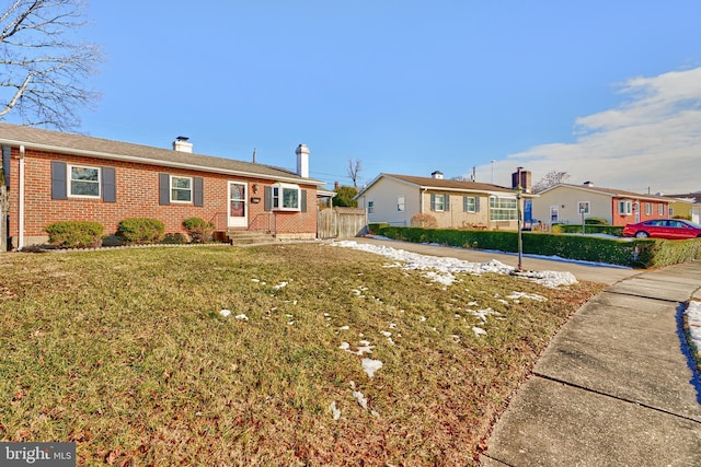 single story home with a front yard