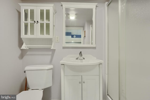 bathroom with toilet and vanity