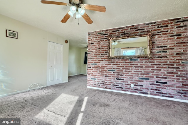 unfurnished living room featuring a textured ceiling and carpet