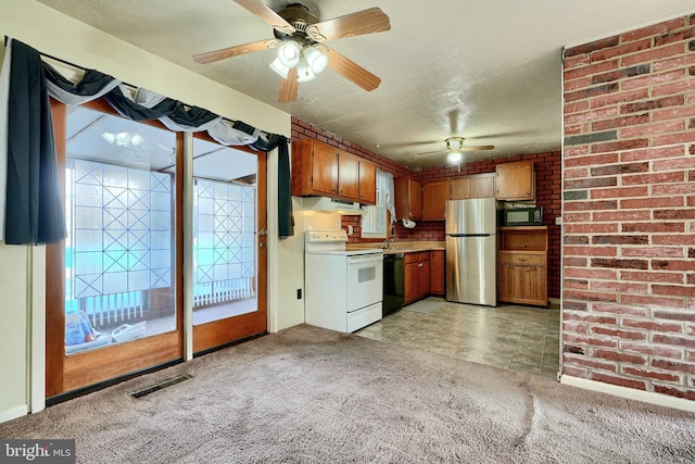 kitchen featuring light colored carpet, white electric stove, dishwasher, and stainless steel refrigerator