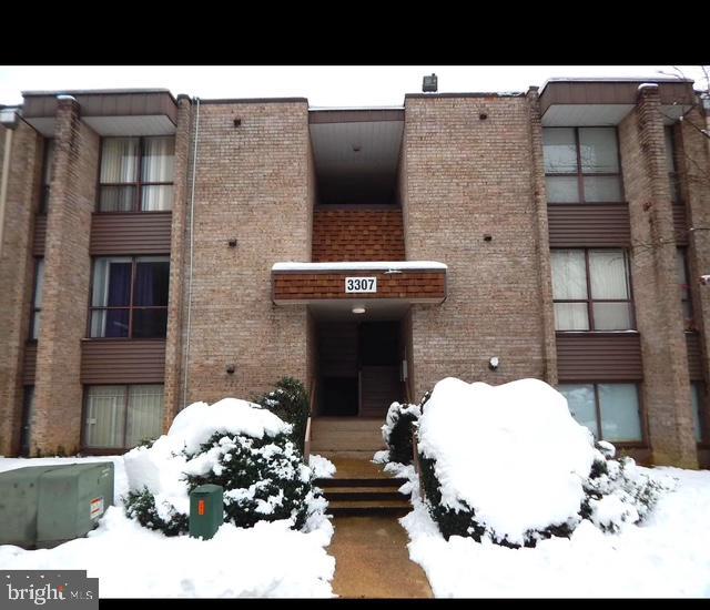 view of snow covered building