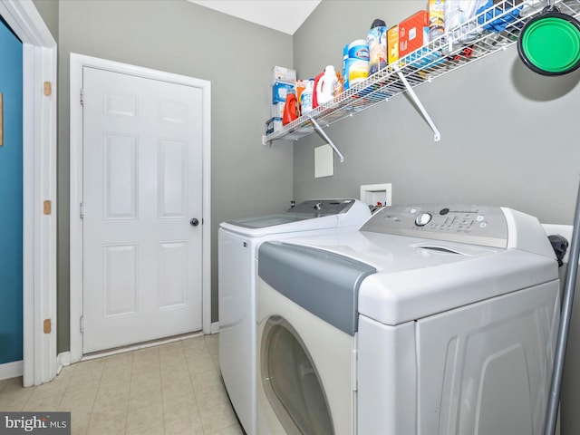 washroom featuring independent washer and dryer