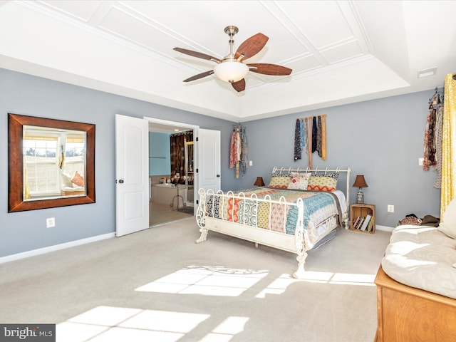 carpeted bedroom featuring crown molding, ceiling fan, and a tray ceiling