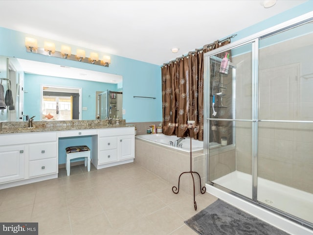 bathroom with plus walk in shower, vanity, and tile patterned floors