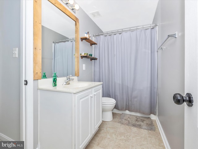 bathroom featuring tile patterned flooring, vanity, curtained shower, and toilet