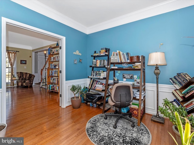 home office featuring hardwood / wood-style flooring and ornamental molding