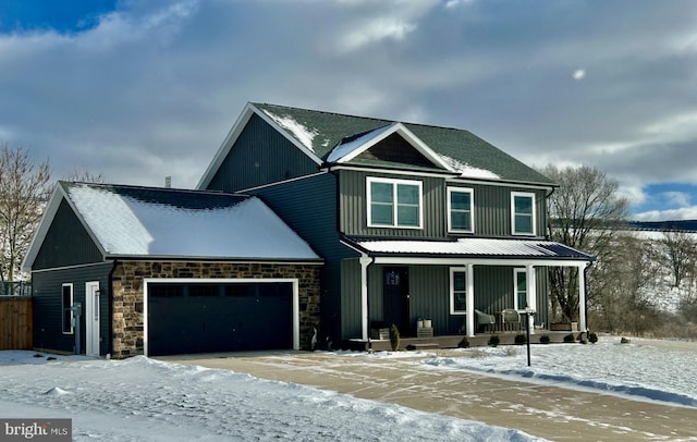 view of front facade with a garage and covered porch