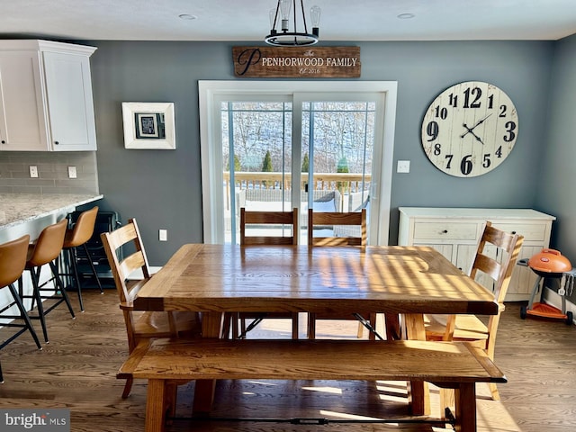 dining space featuring hardwood / wood-style flooring