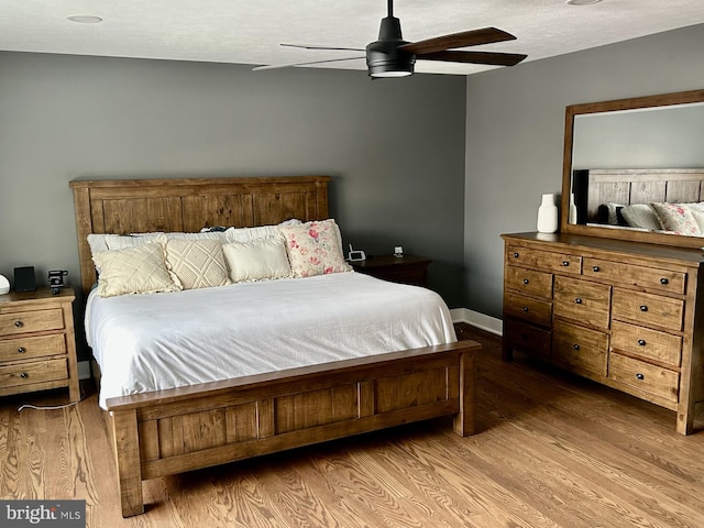 bedroom featuring ceiling fan and light hardwood / wood-style floors