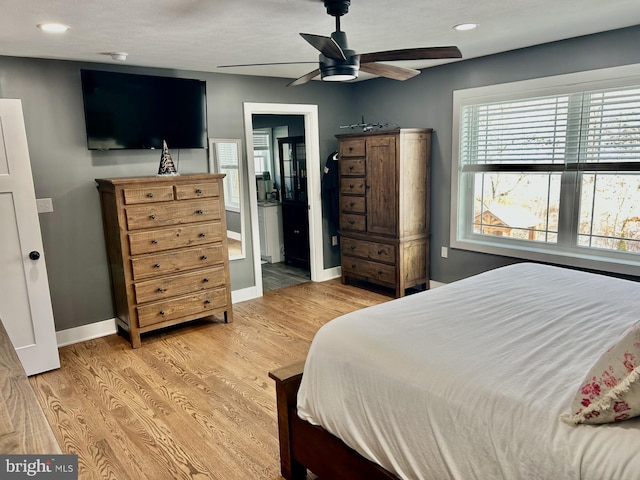 bedroom featuring hardwood / wood-style flooring and ceiling fan