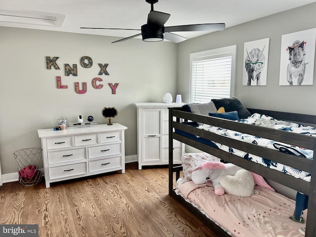 bedroom with ceiling fan and light wood-type flooring