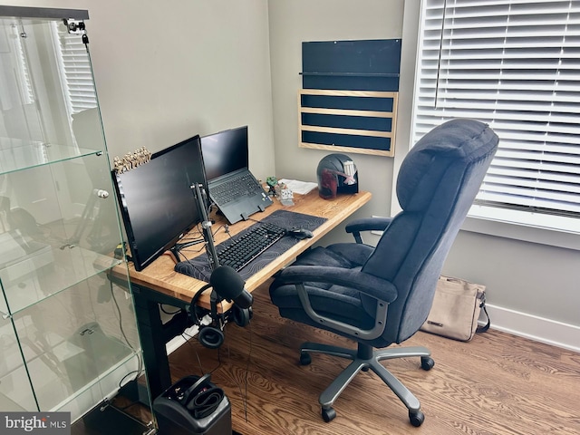 home office with hardwood / wood-style floors