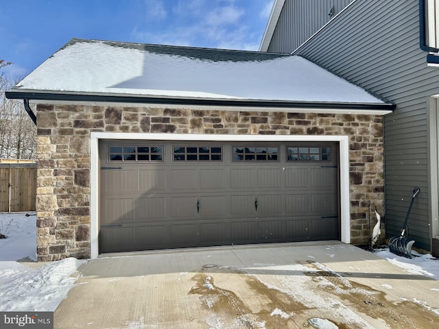 view of snow covered garage