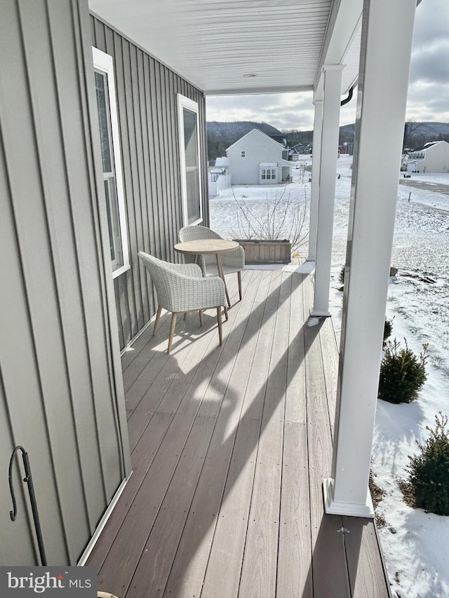 view of snow covered deck