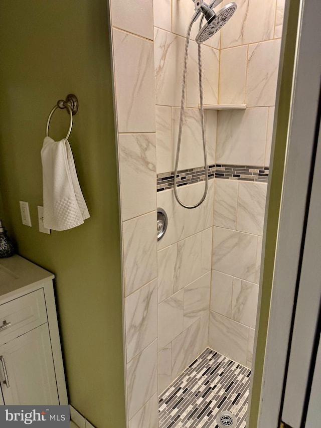 bathroom with a tile shower