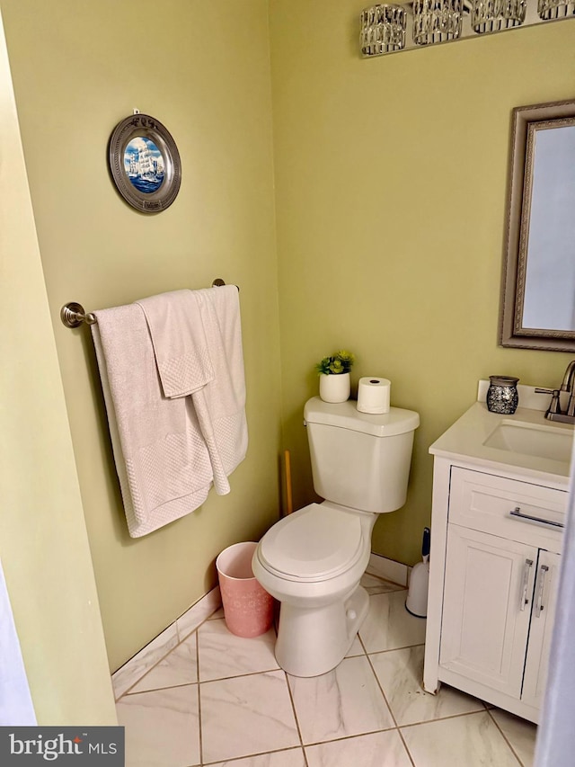 bathroom with toilet and vanity